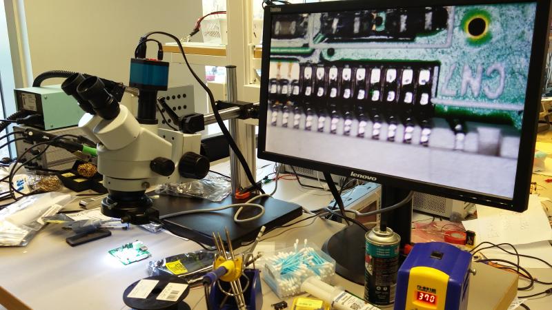 Monitor showing microscope view of LCD controller board