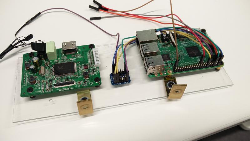 Raspberry Pi 3, LCD controller board, and logic level shifter mounted on acrylic sheet