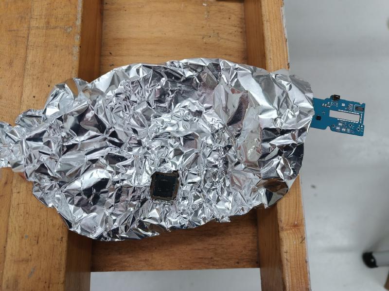 Aluminum foil shield over tablet motherboard