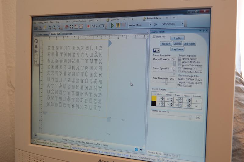 Laser cutter program loaded with face of word clock