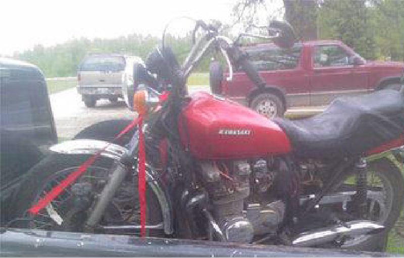 Red KZ650 in bed of an old truck