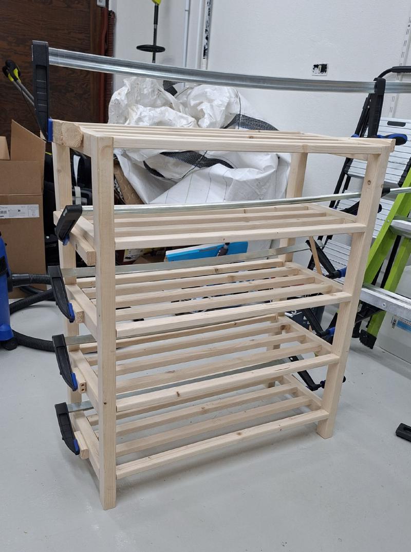 Fully assembled shoe rack glued up and curing in clamps