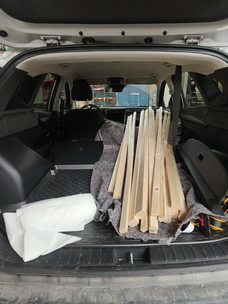 Lumber loaded into back of car