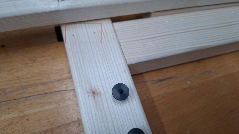 Close-up of positioning pins and marks they leave