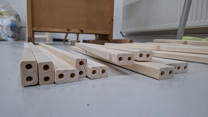 Slats with holes drilled in them on floor